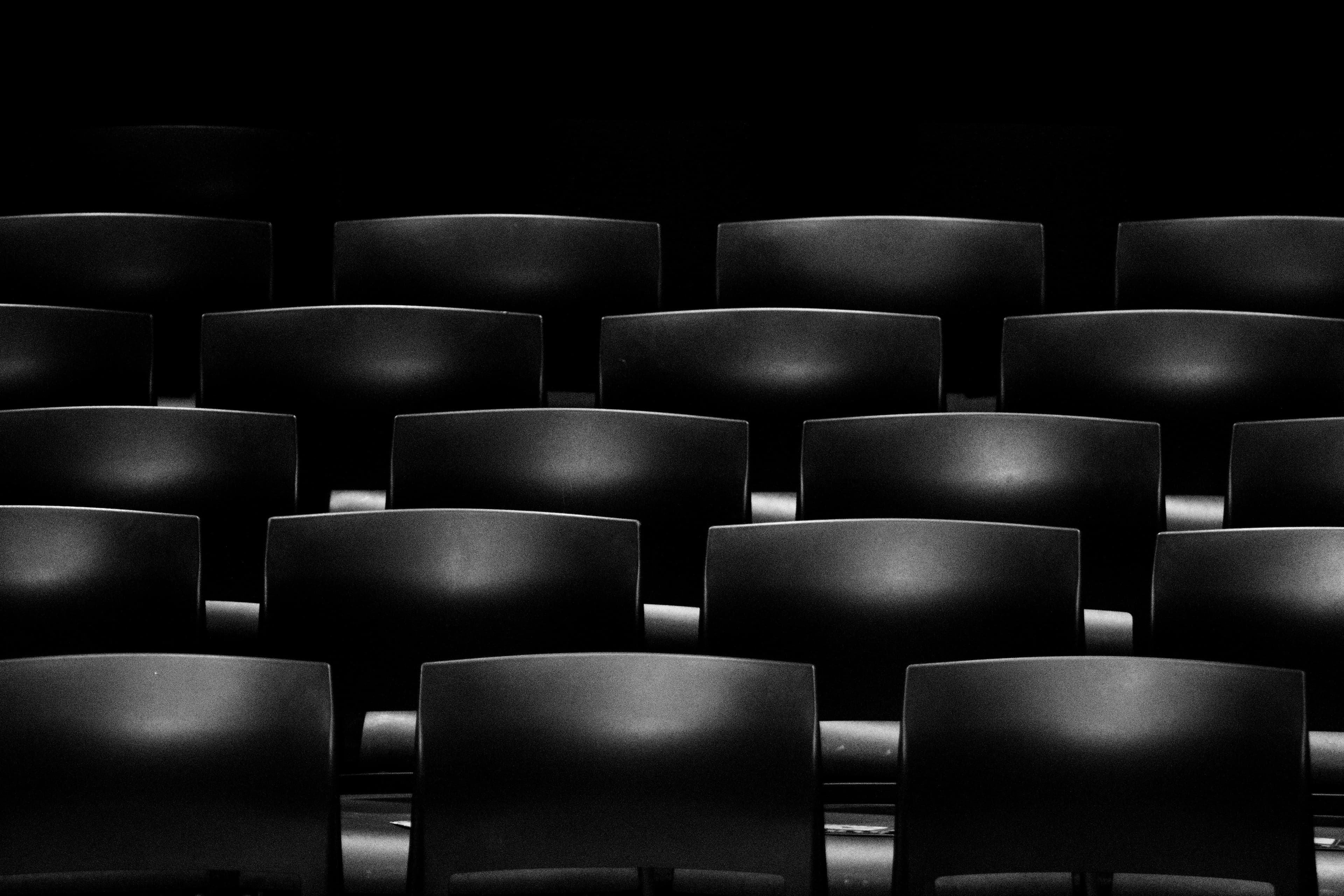 A quiet auditorium-like space representing Mera Fellowship's reflective learning environment