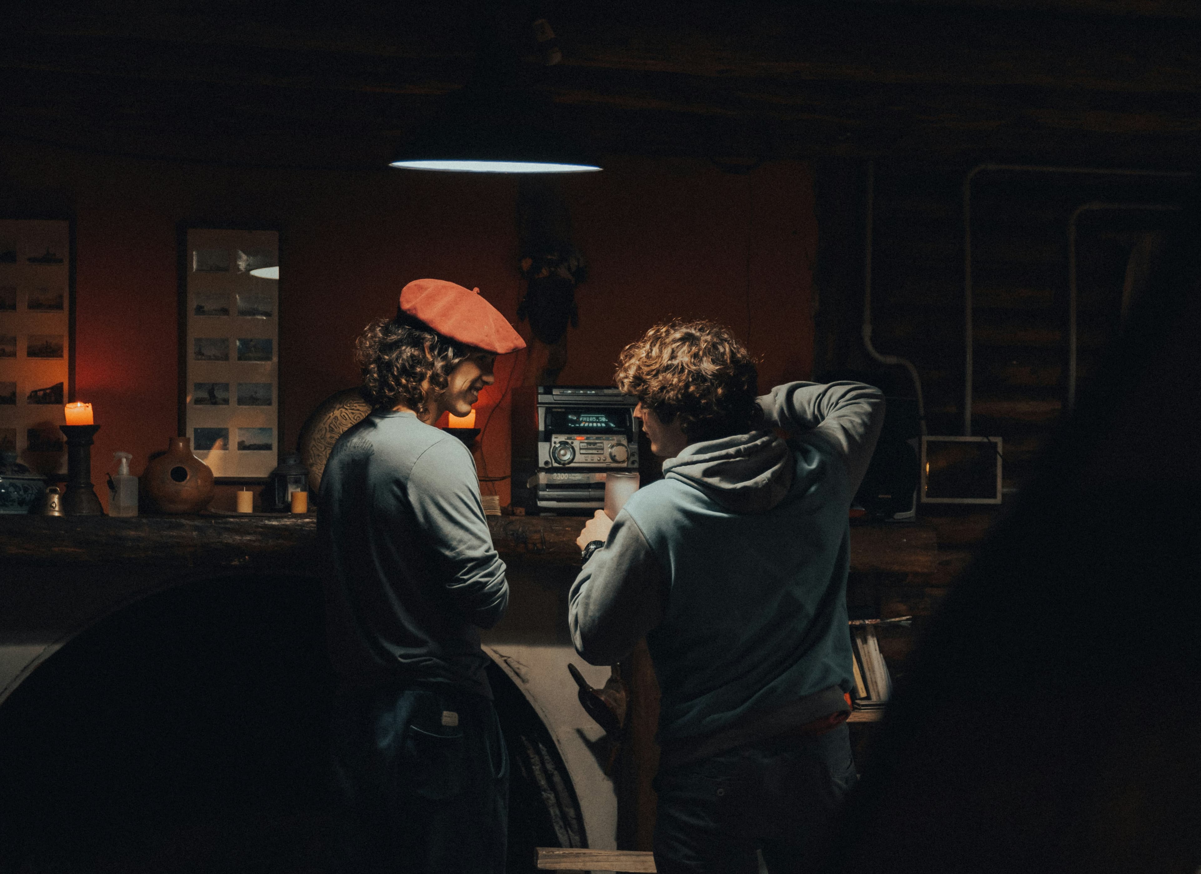 Two people in a quiet conversation at a table